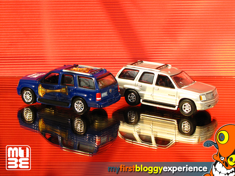 2002 Cadillac Escalade AWD – Full Size Luxury 5-Door SUV 2004 Lightning Strike – New Cars – Real Wheels Series Release 1 4/6 Diecast Scale 1:66 plus 2004 Cadillac Escalade AWD – Full Size Luxury 5-Door SUV 2004 Modern CLUE Series (Mrs. Peacock) 3/6 Diecast Scale 1:66 by Johnny Lightning